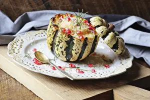 Orange Colored Food Drucke: Pumpkin risotto served in a hollowed pumpkin