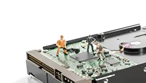 Computer Hardware Repair Drucke: Puppets busy with hardware computer elements repair or format harddisk