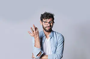 Hispanic Ethnicity Male Drucke: Puzzled man on isolated background