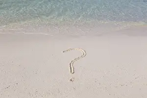 Southeast Asian Landscape Drucke: Question mark written out in sand on a beach