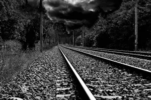 Gloomy Weather Forecast Drucke: Railways track and a stormy sky in background