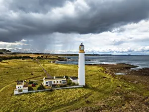 Northern Europe Cloudy Skies Drucke: Rain Clouds over Barns Ness Lighthouse from a drone