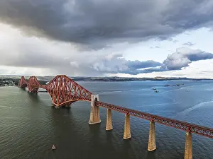 Forth Bridge Scotland Drucke: Rain clouds over Forth Bridge from a drone