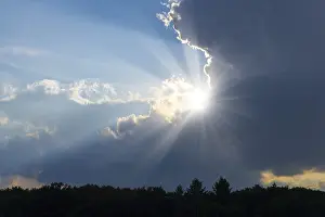Cloudy Blue Skies Drucke: Rain clouds with sun shining through
