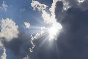 Overcast Blue Skies Drucke: Rain clouds with sun shining through