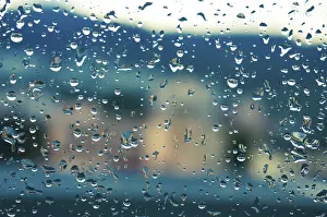 Deserted Evening Scene Drucke: Rain drops on window glasses surface with sunset
