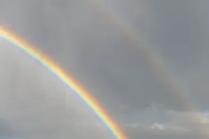 Rainbow In Rain Clouds Drucke: Rainbow appears in rain clouds in spring