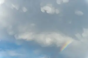 Prismatic Colors In Spring Drucke: Rainbow appears in rain clouds in spring