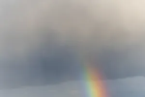 Prismatic Colors In Spring Drucke: Rainbow appears in rain clouds in spring
