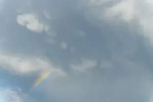 Rainbow In Rain Clouds Drucke: Rainbow appears in rain clouds in spring