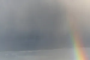 Rainbow In Rain Clouds Drucke: Rainbow appears in rain clouds in spring