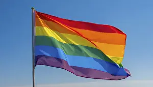 Rainbow Flag Symbol Drucke: The rainbow flag flutters in the wind