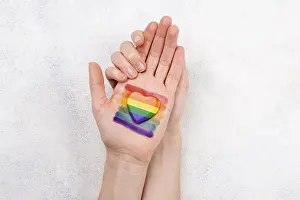 LGBTQ Community Drucke: Rainbow flag painted hand