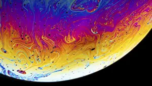 Deserted Interior Space Photo Drucke: Rainbow soap bubble on a dark background