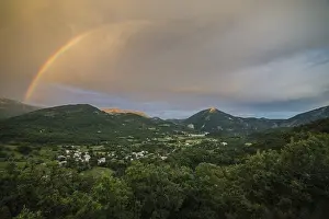 Cloudy Sky With Rainbow Colors Drucke: Rainbow over the valley of Castellane