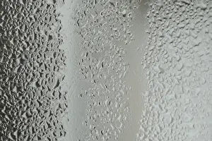 Deserted Rainy Scene Drucke: Raindrops on window glass on blur grey background