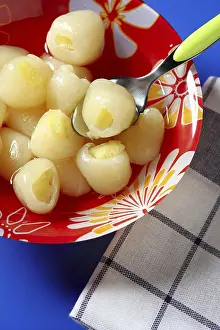 Tropical Food Photography Drucke: Rambutan, lychee with pineapple inside dessert
