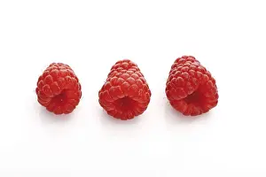 Fruity Food Still Life Drucke: Three raspberries, side by side