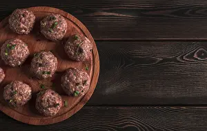 Meatball Photography Drucke: Raw meatballs, with micro greenery