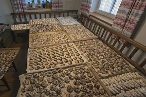 European Desserts Drucke: Ready-baked biscuits arranged on baking trays on the table