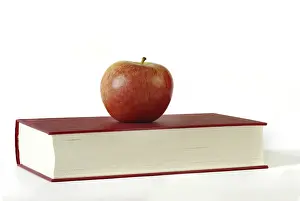 Nutrition Facts Drucke: Red apple on a red book