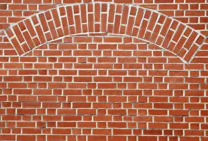 Deserted Building Architecture Drucke: Red brick wall with an arch