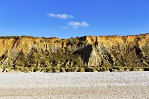Steep Cliff Landscape Photo Drucke: Red cliff in the evening light