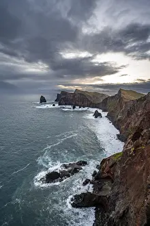 Steep Rock Face Photography Drucke: Red cliffs and rocks in the sea