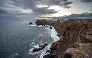 Red Cliffs Portugal Drucke: Red cliffs and rocks in the sea