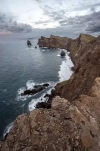 Red Cliffs Portugal Drucke: Red cliffs and rocks in the sea