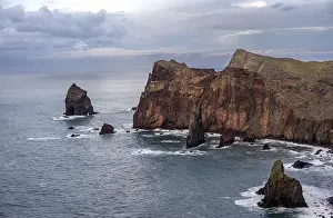 Red Cliffs Portugal Drucke: Red cliffs and rocks in the sea