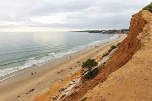 European Coastal Landscapes Drucke: Red cliffs on sandy beach in Algrave