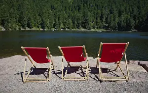 Deserted Waterfront In Germany Drucke: Three red, empty deckchairs, Mummelsee