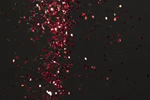 Red Glitter Background Drucke: Red glitter on black background
