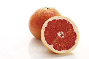 Close Up Citrus Fruit Drucke: Red grapefruit, Ruby Star, one whole and one half