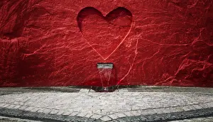 Symbolic Heart Shape Drucke: Red heart in a wall