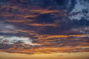 German Cloudy Landscape Drucke: Red illuminated clouds after a sunset