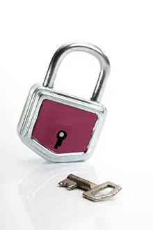 Exposed Studio Photography Drucke: Red padlock and key