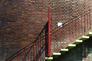 Water Supply System Drucke: Red staircase on a brick wall