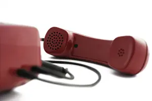 Studio Shot Of A Phone Drucke: Detail of a red telephone
