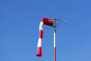Blue Sky Symbol Drucke: Red and white windsock against blue sky