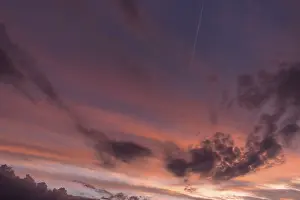 Central Europe Cloudy Skies Drucke: Reddish clouds in the evening sky