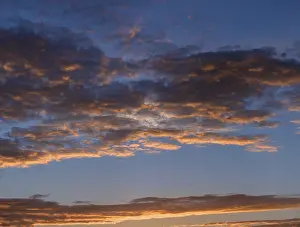 Southern Germany Cloudy Skies Drucke: Reddish clouds in the evening sky