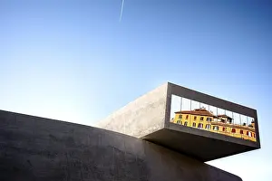 Clear Blue Sky Reflections Drucke: Reflected building in the window of the Maxxi Museum under a clear sky