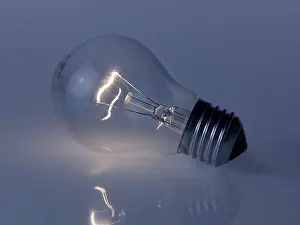 Bright Studio Lighting Drucke: Reflected, glowing light bulb on blue-gray