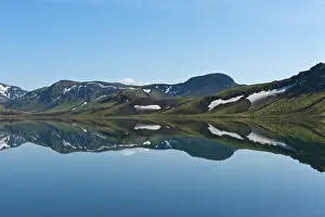 Blue Sky Daytime Photography Drucke: Reflection in the still lake, remnants of snow