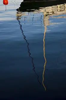 Bavarian Waterfront Scene Drucke: Reflection of a sailboat in the water