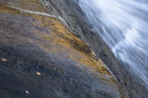 Lapland Landscape Photography Drucke: Reflections on a rock at a rushing stream