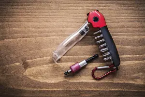 Handicraft Construction Equipment Drucke: Replaceable turnscrew bits in toolbox on wooden board construction concept