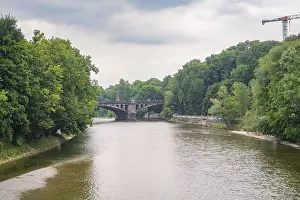 Bavarian River Scenery Drucke: River view with a stone bridge in the background